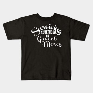 Surviving adulthood on Grace and Mercy Christian Design Kids T-Shirt